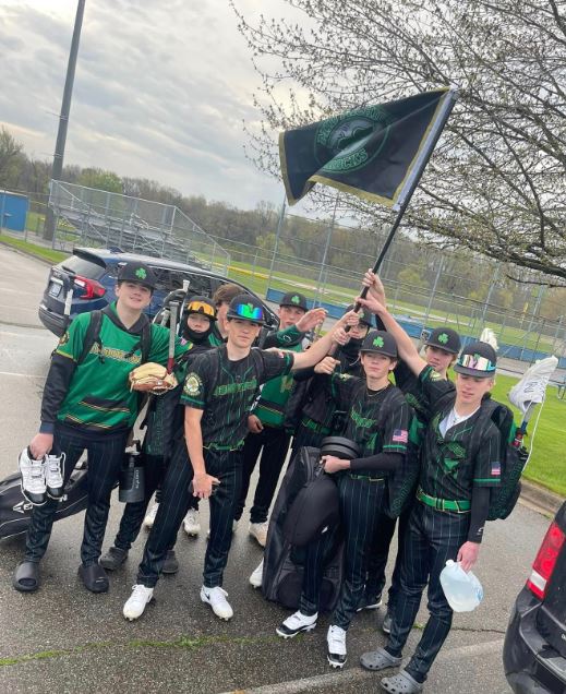 Shamrocks team carrying the team flag